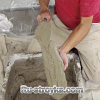 Как декорировать камин при помощи искусственного камня.