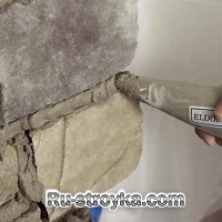 Как декорировать камин при помощи искусственного камня.